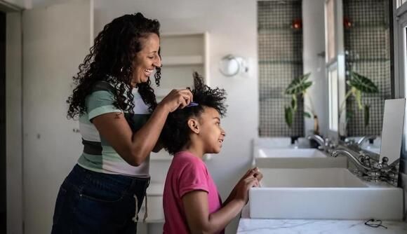 mum doing her child's hair