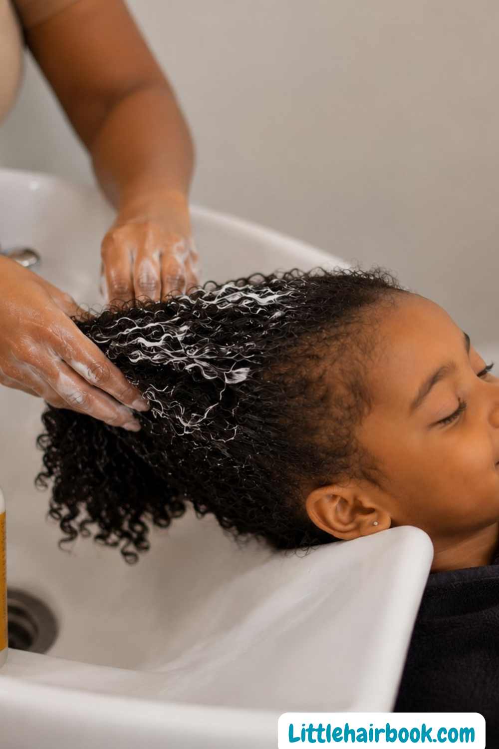 mum conditioning her childs hair